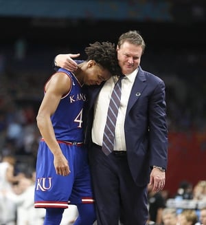 University of Kansas head basketball coach Bill Self comforts star player Devonte Graham after the Jayhawks’ semifinal loss to Villanova University at this year’s NCAA tournament.